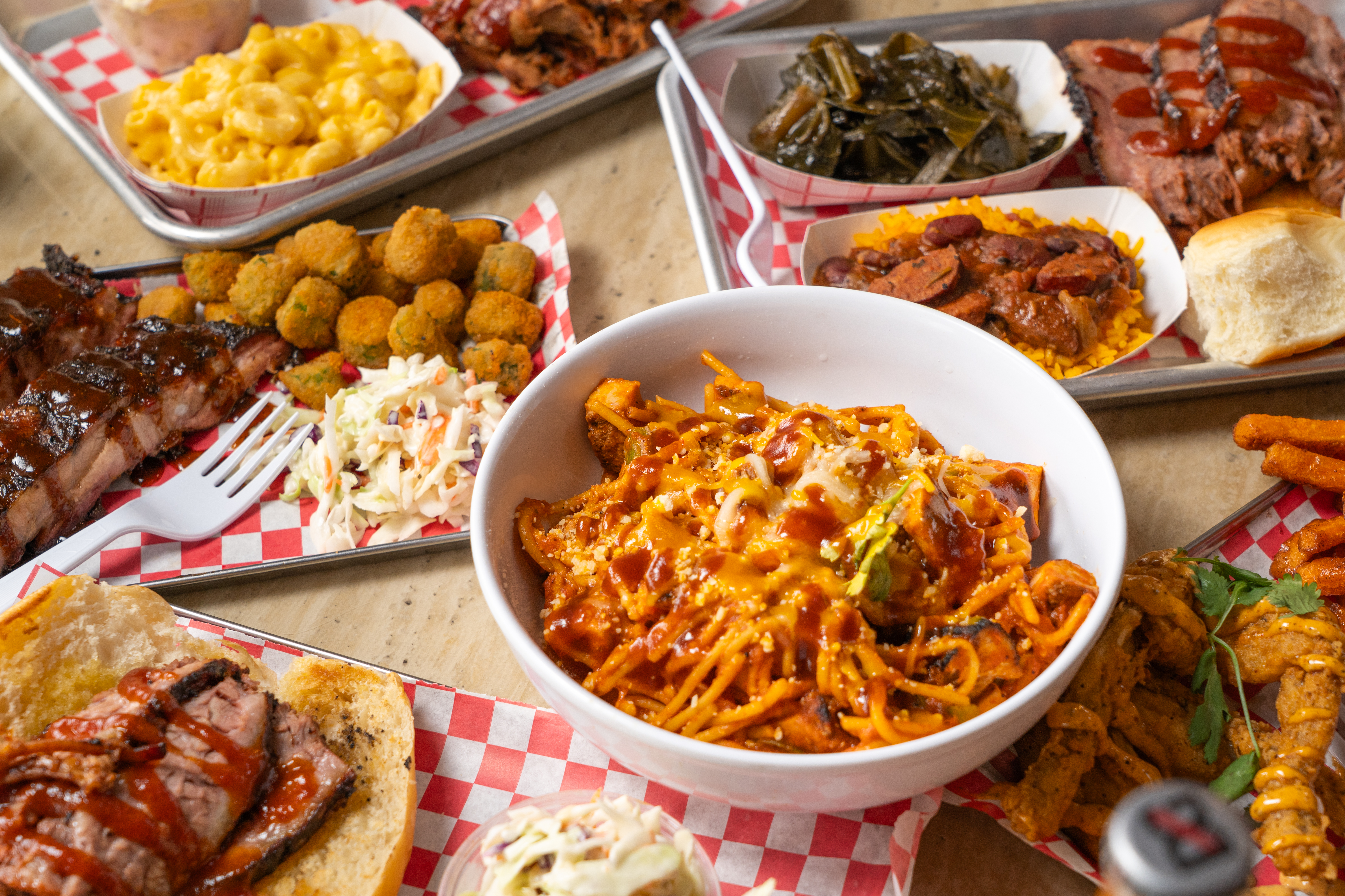 Assortment Of Food Items Like Mac And Cheese, Ribs, Pasta, etc.